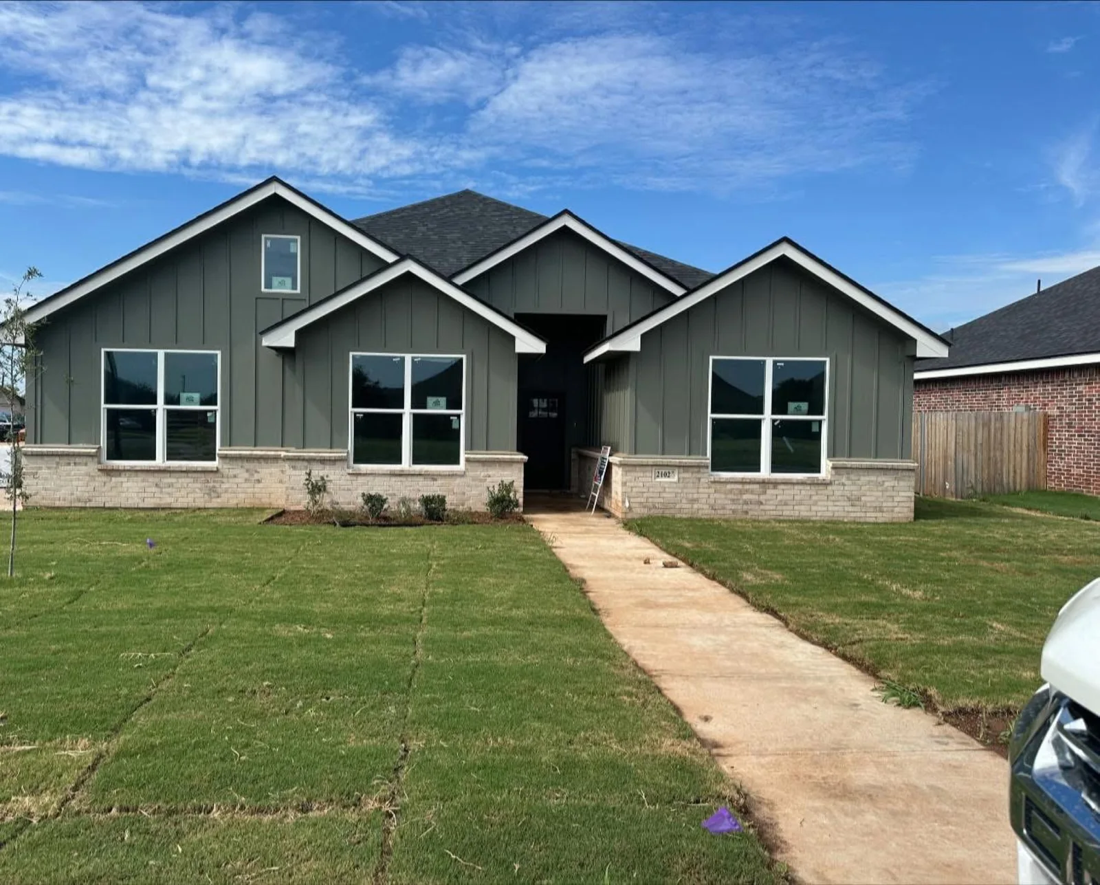 Green and cream painted home exterior